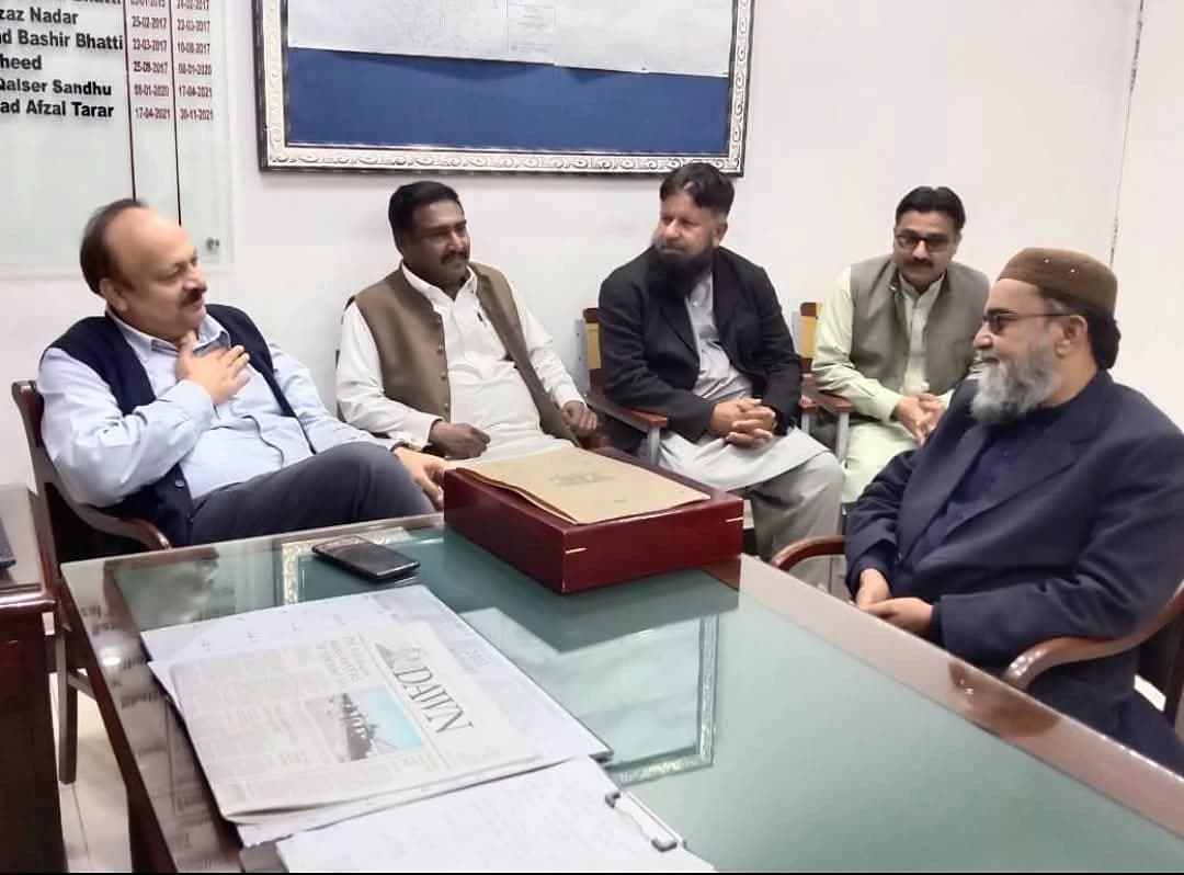 HRPF representatives in a meeting at an office table.