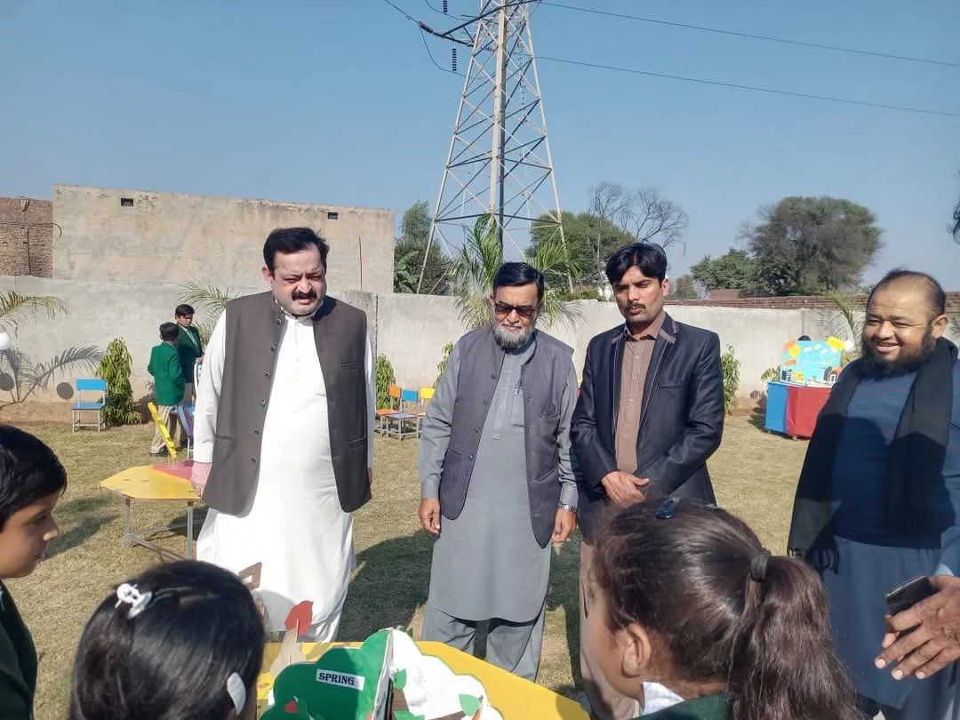 HRPF representatives visiting student displays at The Smart School